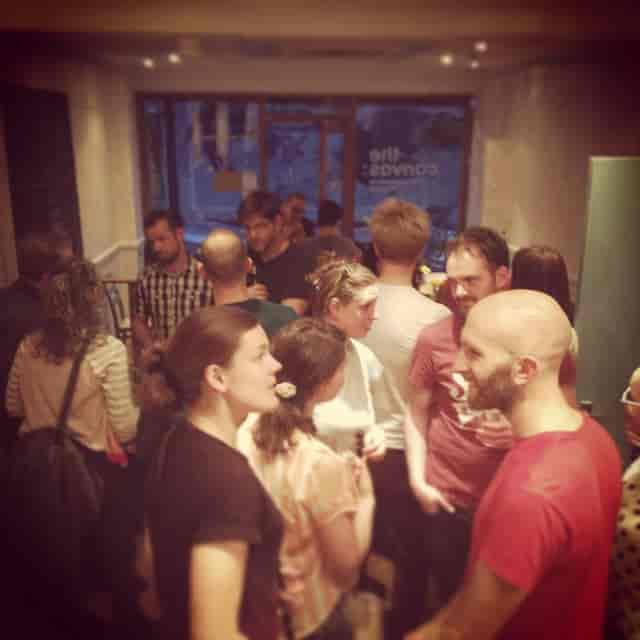 Networking event at Cafe in The Canvas, diverse attendees engaging in lively discussions.