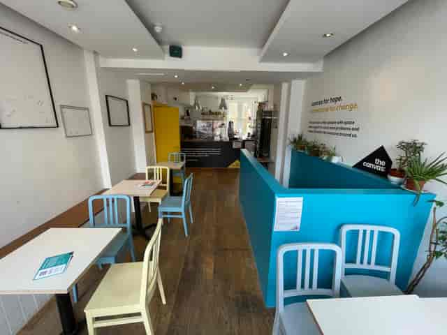 Bright cafe with vibrant decor, ideal for meetings and small events in The Canvas.