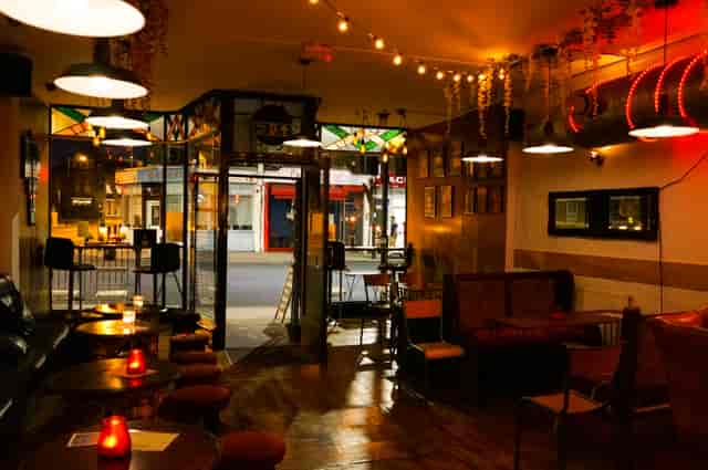 Cozy Main Bar in T-Bird with warm lighting, ideal for networking events and gatherings.