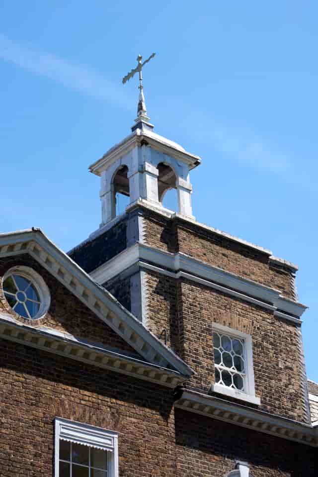 Historic Bell House venue with elegant bell tower, perfect for unique events and gatherings.