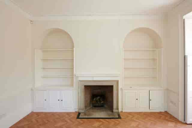 Lutyens' room at Bell House: minimalist space with fireplace, ideal for workshops and meetings.