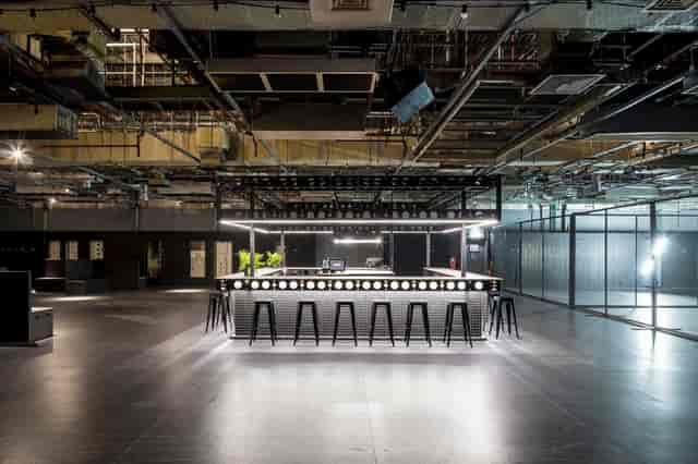 Modern Control Room at Printworks London, featuring sleek bar for events and networking.