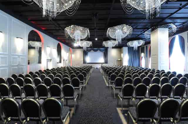 International Suite at Mercure Manchester, elegant conference venue with chairs and screen.