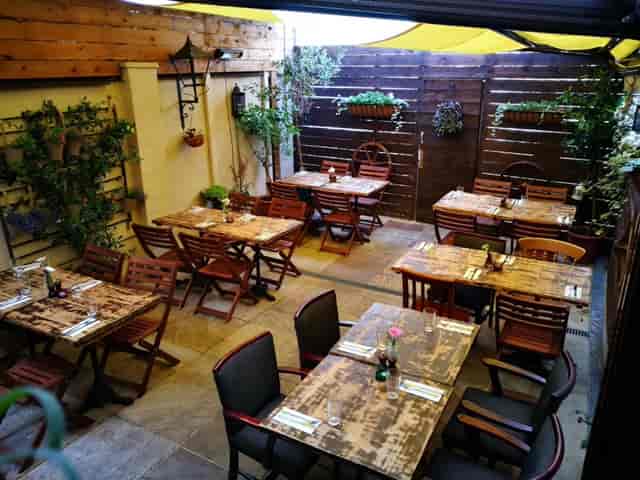 Charming outdoor dining space at Rullo's, perfect for intimate gatherings and team lunches.