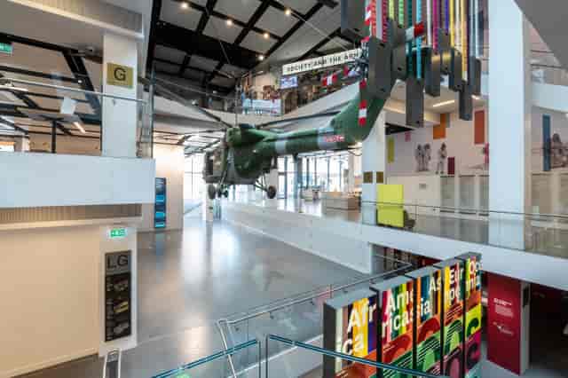 Atrium in National Army Museum with suspended helicopter, ideal for corporate events and exhibitions.
