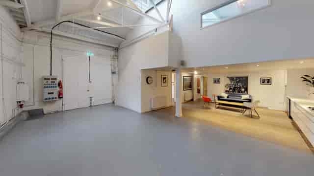 Versatile event space in Park Village with high ceilings for corporate meetings and gatherings.