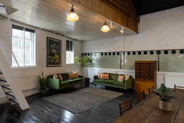 Versatile meeting space at The Stables, Park Village, ideal for workshops and gatherings.
