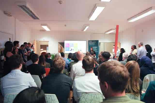 Conference space in Allia Future Business Centre, East London, with engaging speaker and attentive audience.