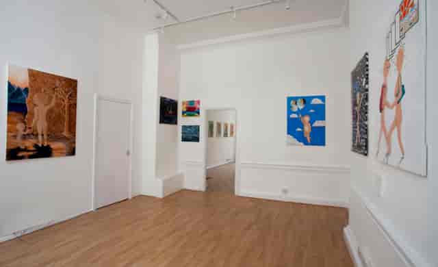 Spacious Zari Gallery with white walls, ideal for art exhibitions and receptions.