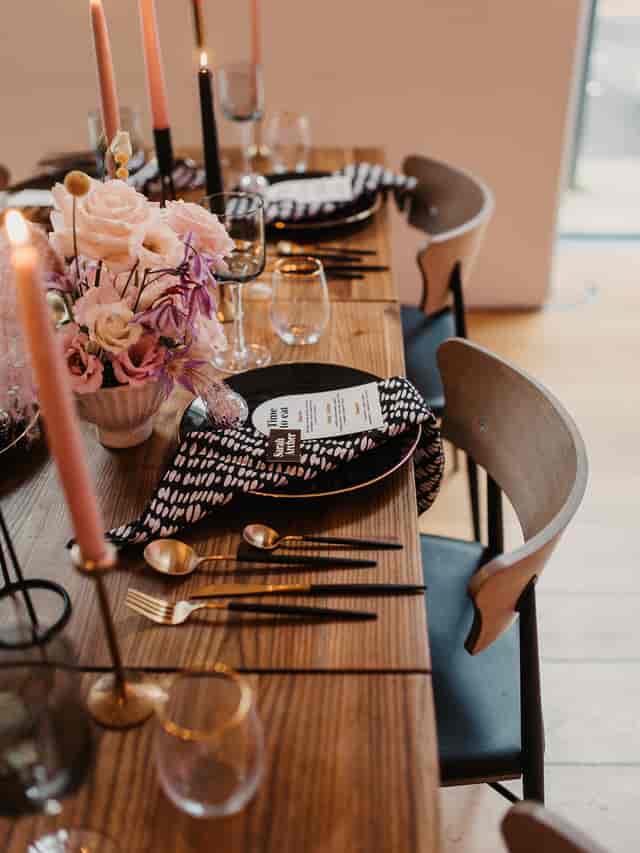 Elegant dining table setup with floral centerpieces for upscale events at The Goldsmiths' Centre.