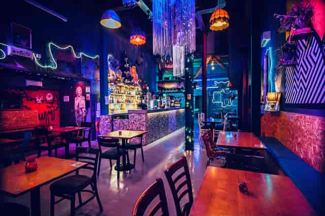 Vibrant Tank Room venue with colorful lighting for creative events and gatherings.