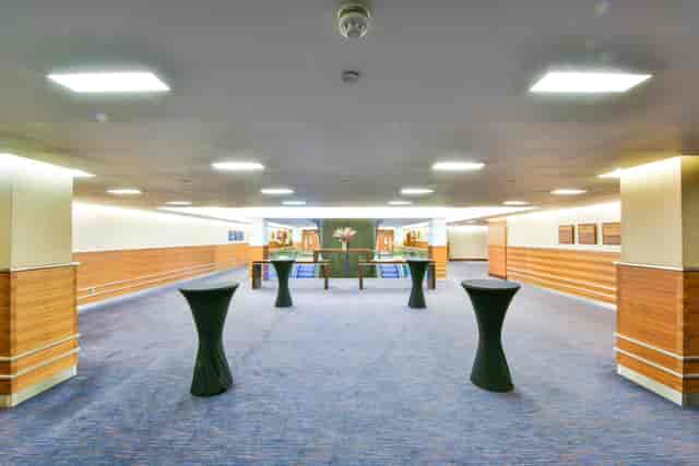 Arora Theatre event space with high-top tables for networking at Sofitel London Heathrow.