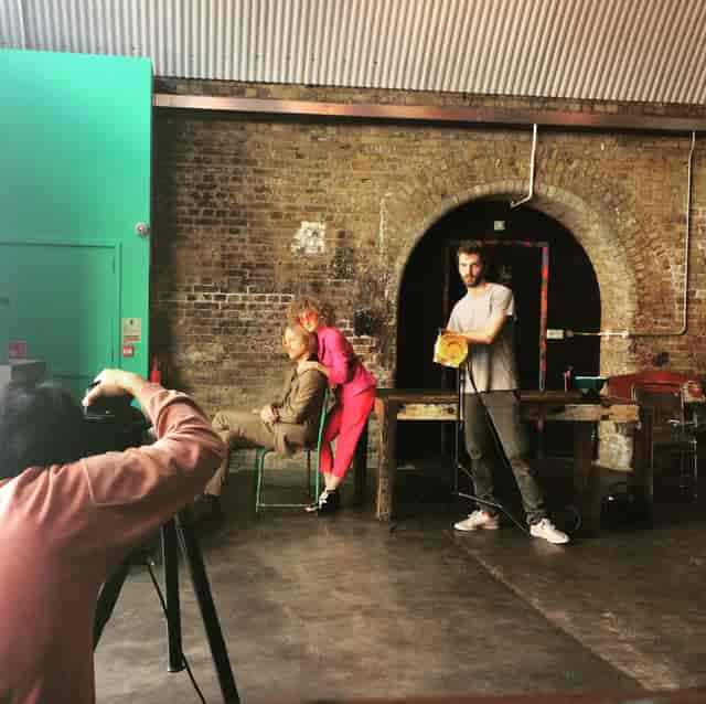 Creative photoshoot setup at The Doodle Bar, featuring an industrial backdrop for events.