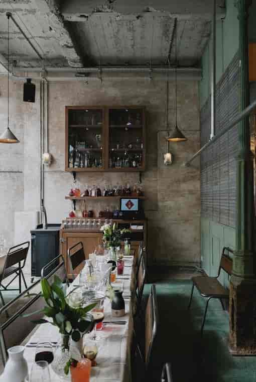 Bitters Bar in Canova Hall: modern venue with rustic decor for intimate gatherings and events.