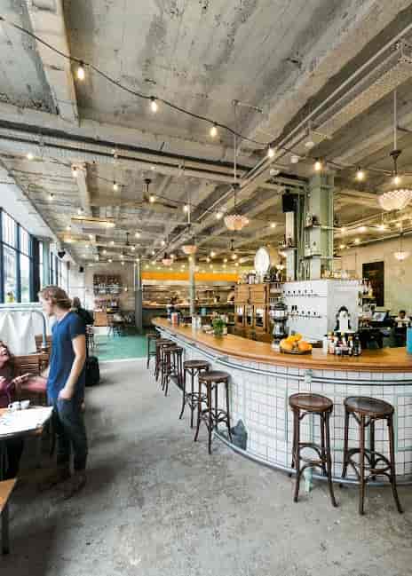 Bitters Bar in Canova Hall: modern café with warm lighting for networking events.