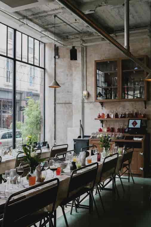 Stylish Bitters Bar event space with large windows, ideal for networking and workshops.