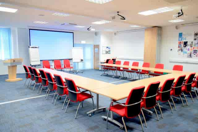 Conference room with U-shaped seating for collaboration at Humanitarian Academy for Development.