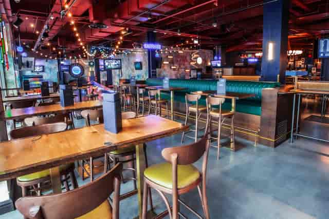 Sapphire Area at Puttshack White City, vibrant event space with flexible seating.