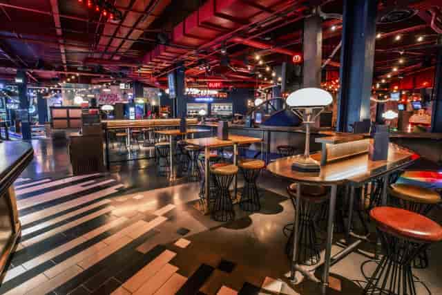 Emerald Area at Puttshack White City: vibrant event space for networking and gatherings.