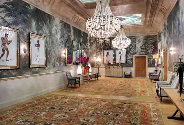 Elegant foyer with chandeliers at Haymarket Hotel for upscale receptions and networking events.