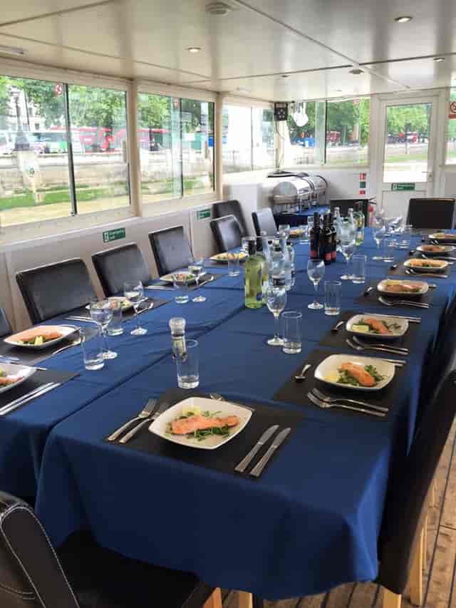 Elegant dining setup for a corporate event at MV Arcadian King Edward.
