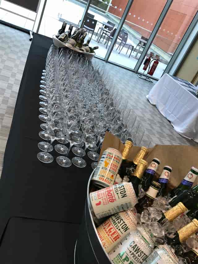 Sparkling wine glasses arranged for a sophisticated celebration at King’s Hedges, Cambridge.