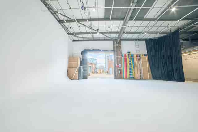 Versatile event space with white backdrop at Cineview Studios, ideal for corporate events.