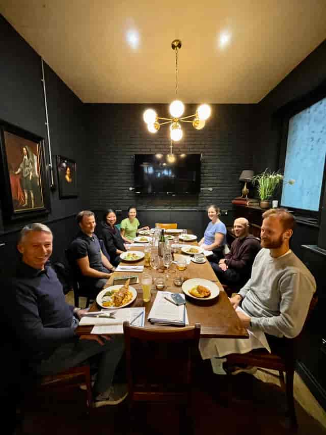 Cozy dinner meeting at The Tokenhouse Main Bar with warm lighting and inviting decor.