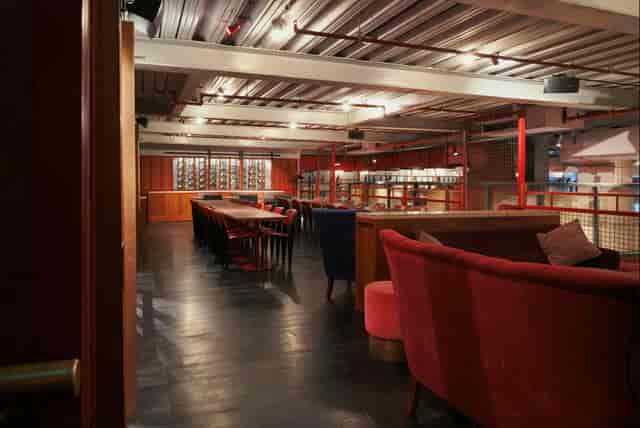 Industrial event space, wood beams, product launch, networking