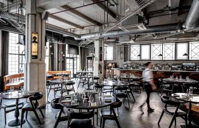 Modern industrial restaurant venue with spacious layout for events in Southwark.