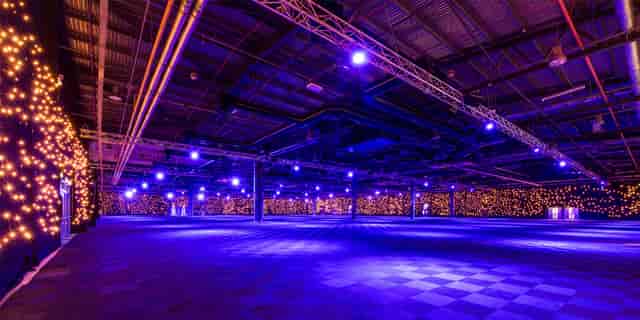 Spacious EventCity Hall 4 with ambient lighting for vibrant trade shows and conferences.