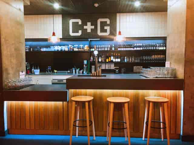 Stylish bar area in Cut and Grind, perfect for networking events and casual gatherings.