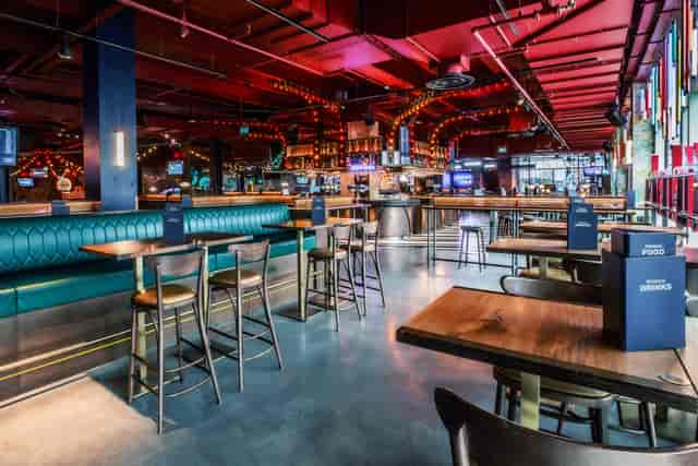 Vibrant event space at Puttshack White City with modern design for networking events.