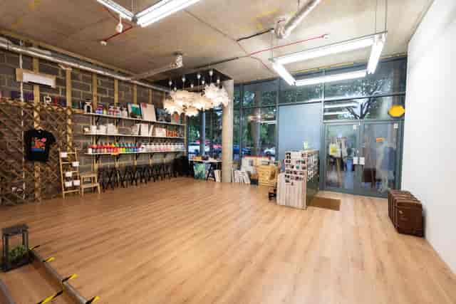 Versatile event space in Studio 249 with wooden flooring for workshops and gatherings.