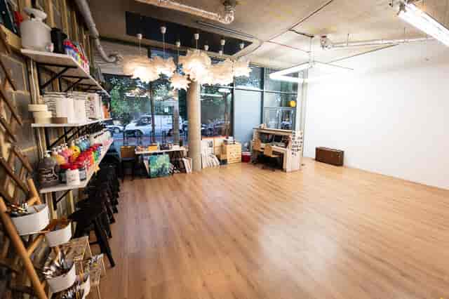 Versatile event space in Studio 249 with natural light, ideal for workshops and gatherings.