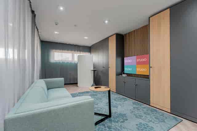 Modern multifunctional meeting space in FACT Liverpool for creative collaboration and brainstorming.
