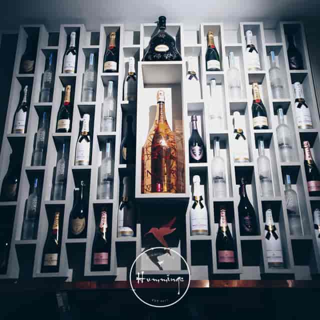 Upscale venue with elegant wine display, perfect for receptions and celebrations.