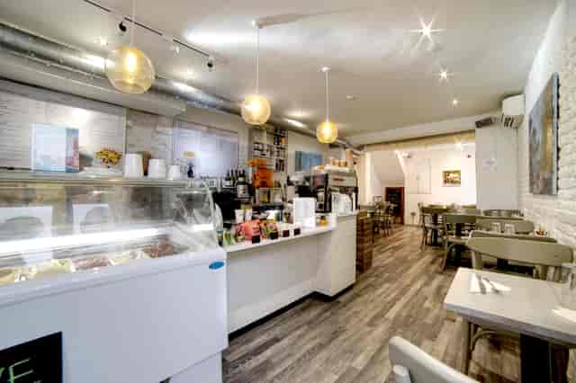 Cozy Chelsea Creperie venue with warm lighting, perfect for small events and meetings.