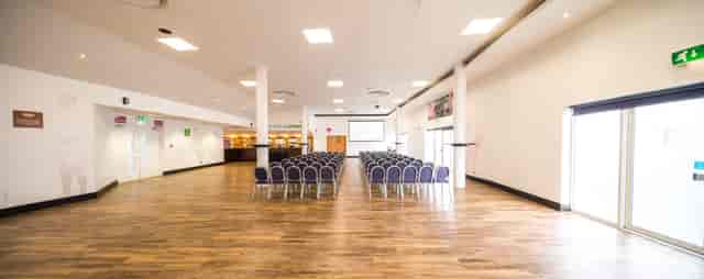 Twickenham Stoop Stadium conference setup with modern seating and natural light.