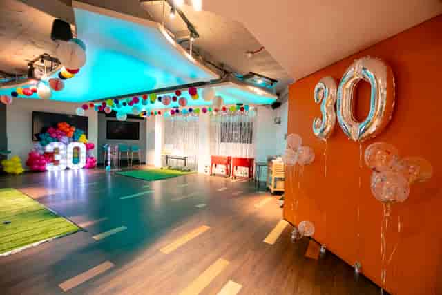 Vibrant event space with colorful decor for a 30th birthday celebration.