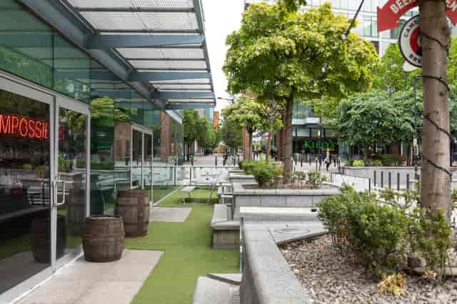 Vibrant outdoor space at Impossible Manchester for casual meetings and events.