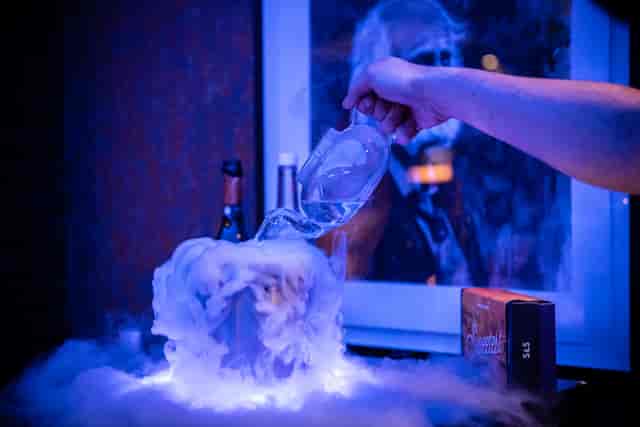 Creative beverage display with smoke effects for events and cocktail parties.