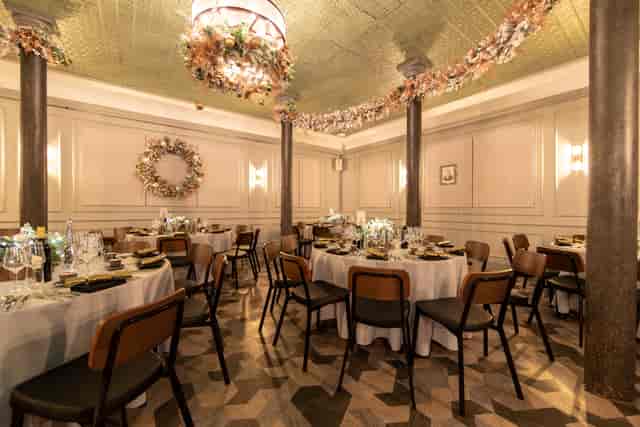 Elegant dining room with round tables for upscale events and intimate gatherings.