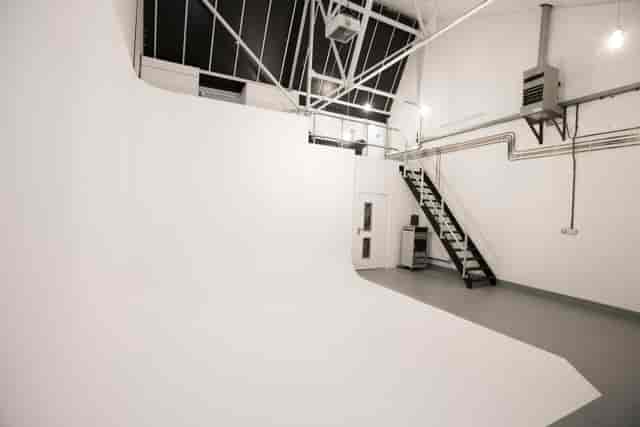 Versatile event space at North 17 Studios with seamless white backdrop for photo shoots.