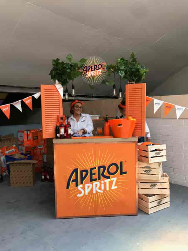 Vibrant Aperol Spritz bar at Hinterlands for networking and celebration events.