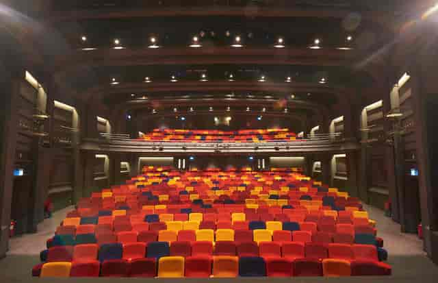 Main Stage Auditorium at Oxford Playhouse with vibrant tiered seating for events.