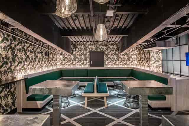 Modern Palm Lounge at Swingers West End, featuring stylish seating for events and networking.