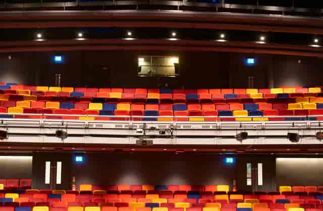 Main Stage Auditorium at Oxford Playhouse with vibrant tiered seating for performances.