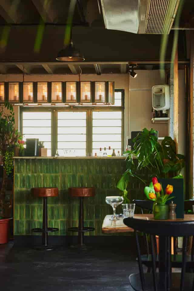 The Mezzanine at The Exhibit Balham: Green tile bar for networking events and cocktail receptions.