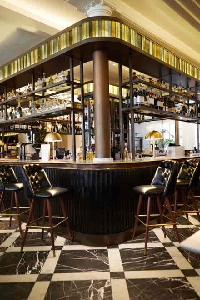 Stylish bar area in Gusto Restaurant, ideal for cocktail receptions and networking events.